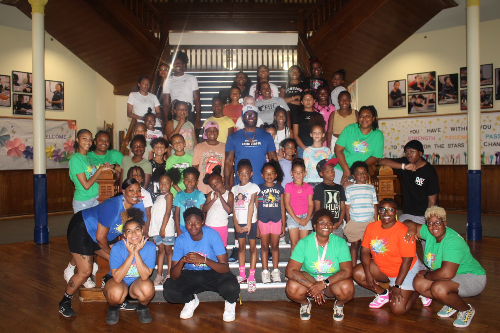 A large group of young people and program staff gathered together